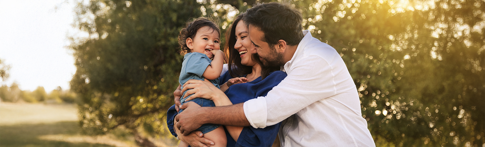 Family sitting outdoors in a serene setting