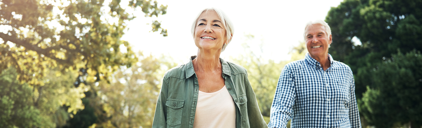 Active couple walking in the park