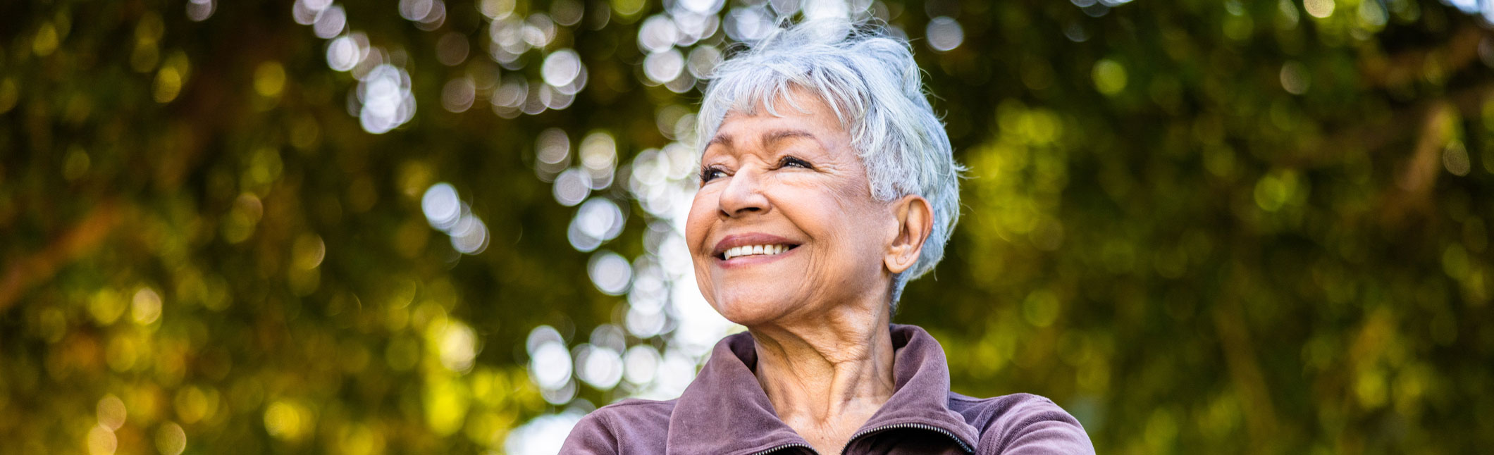 Smiling woman in park setting