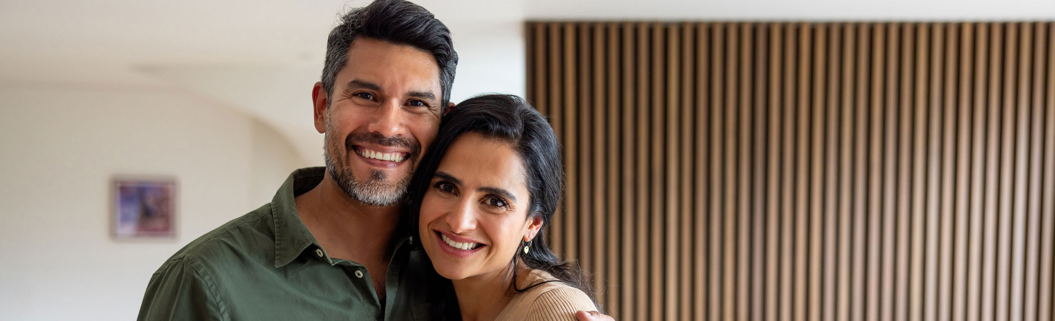 Smiling couple looking at the camera