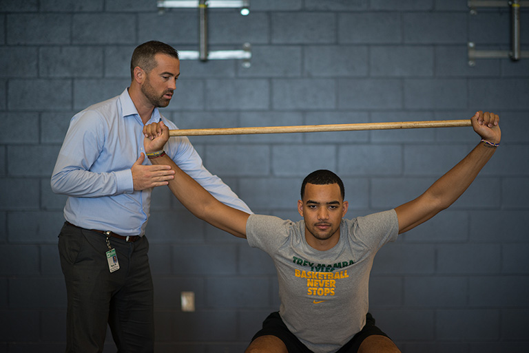 Trey doing physical therapy with Ryan McNeely, DPT, OCS